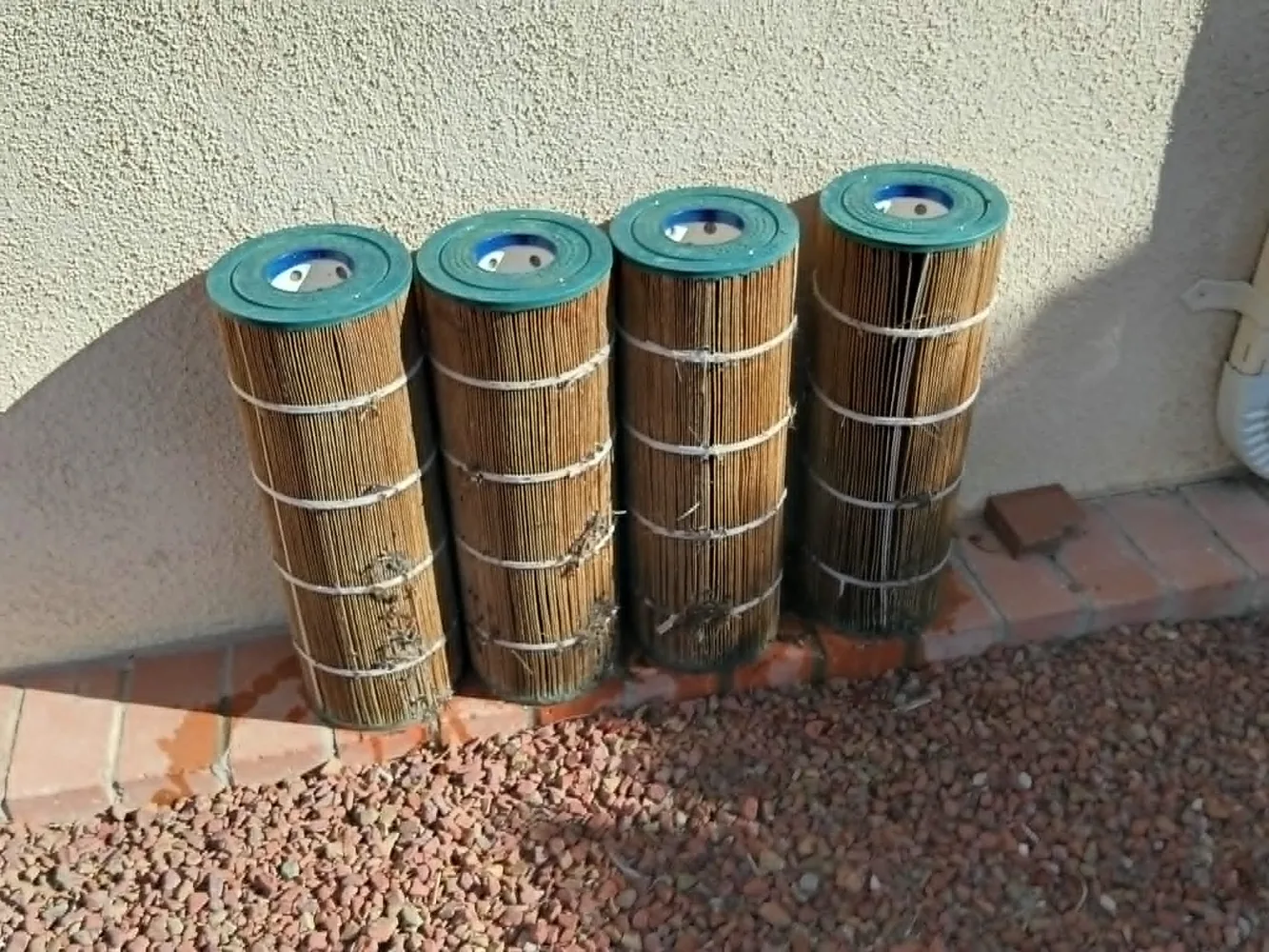 Dirty cartridge pool filters before cleaning